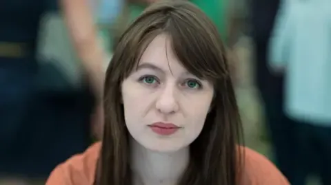 Sally Rooney declares she is unable to enter the UK because of potential arrest